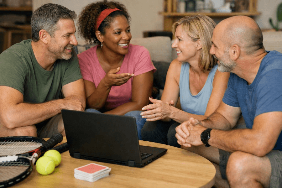 People organizing a group activity using a laptop instead of spreadsheets or text messages People organizing a group activity using a laptop instead of spreadsheets or text messages