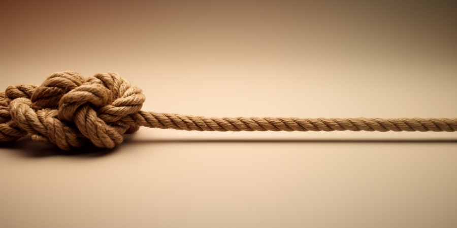 Tangled rope transitioning into a straight line, representing reducing complexity and staff burden.